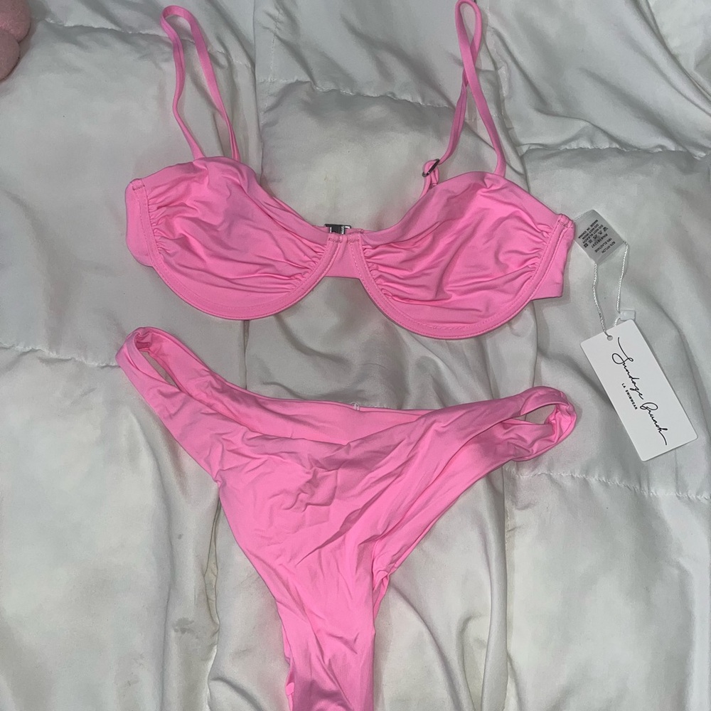 Never worn, New with tags Pink bathing suit